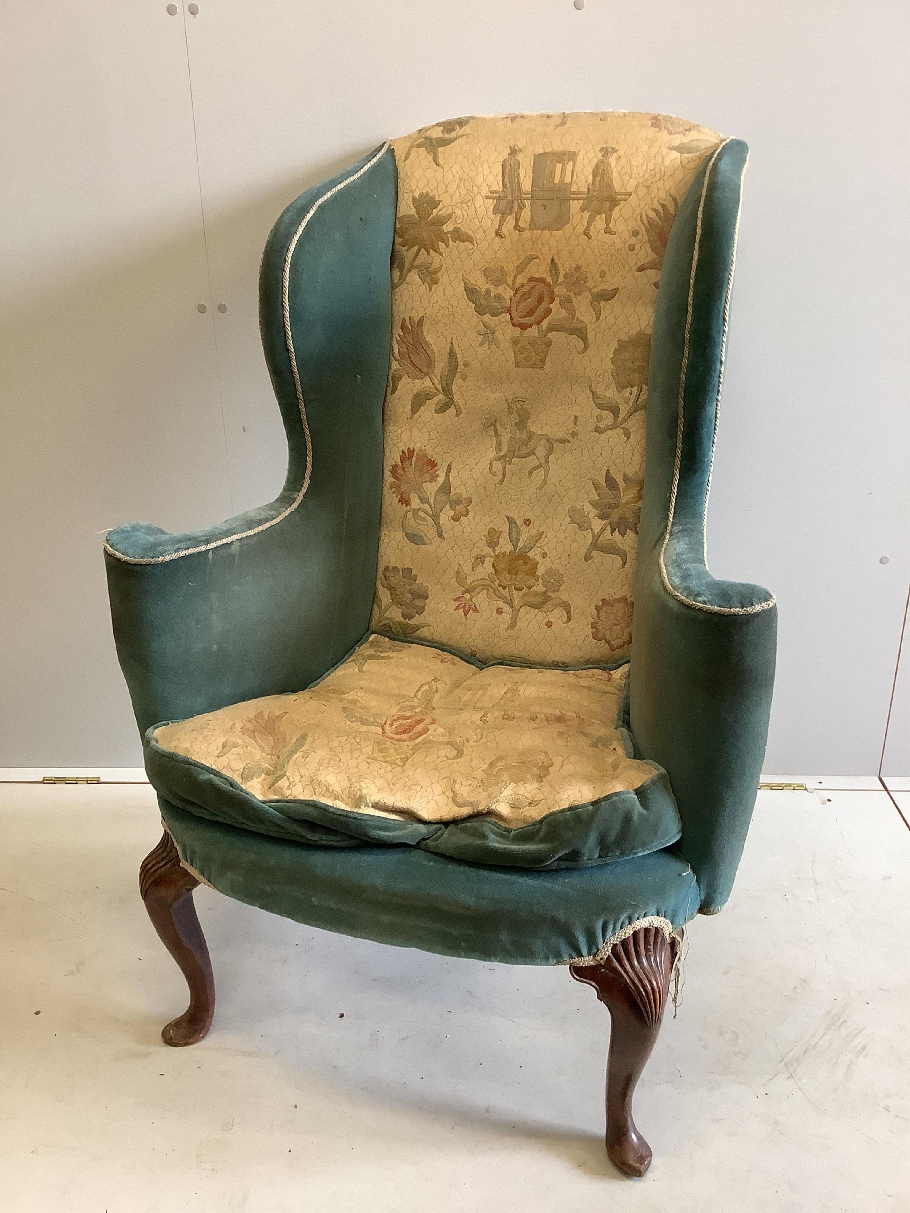A 19th century Queen Anne style upholstered wing armchair, width 82cm, depth 60cm, height 116cm. Condition - fair